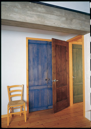 In this Boulder, Colorado, house by architect Jim Logan, pine doors are rubbed with natural dyes such as indigo and logwood.